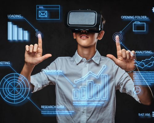 Teenager dressed in a white t-shirt using virtual reality glasses with graph charts, numbers, lines. Technology concept.